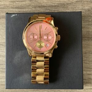 Gold pink face Michael Kors watch. Needs battery